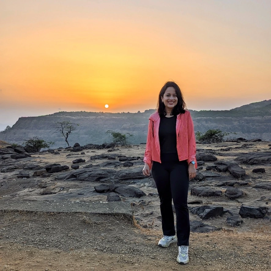 Girl with a pretty sunset as a backdrop