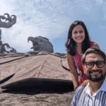 A couple with backdrop of Jatayu Sculpture in Kerala